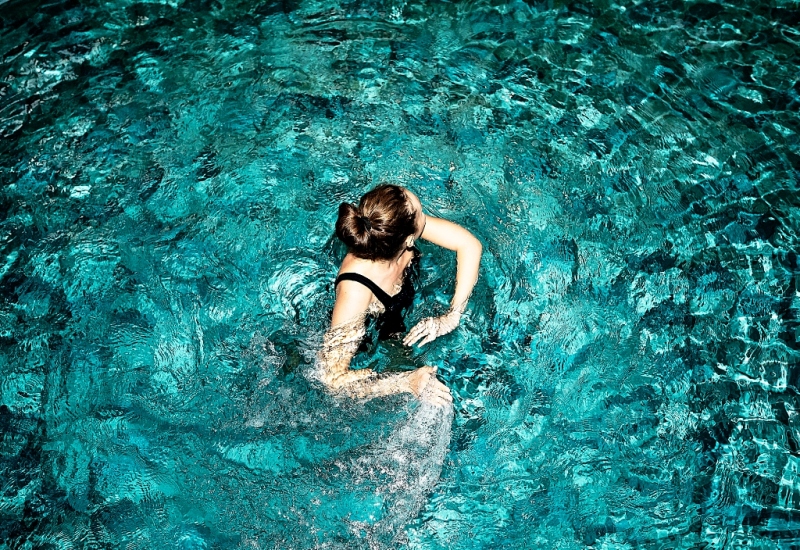 A Woman having fun in a Pool at a Washington DC Luxury Home