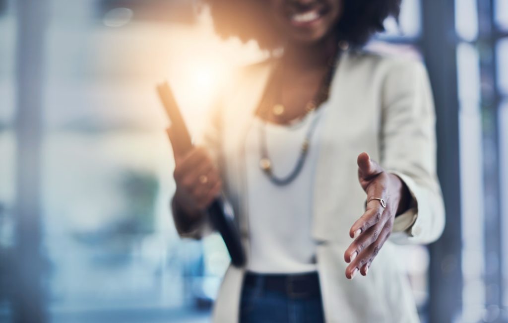 Woman doing a handshake gesture