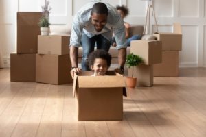 Father and Son inside cardboard box - Heller Coley Reed