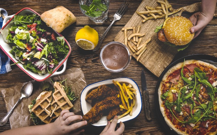 a table topped with plates of food and bowls of food