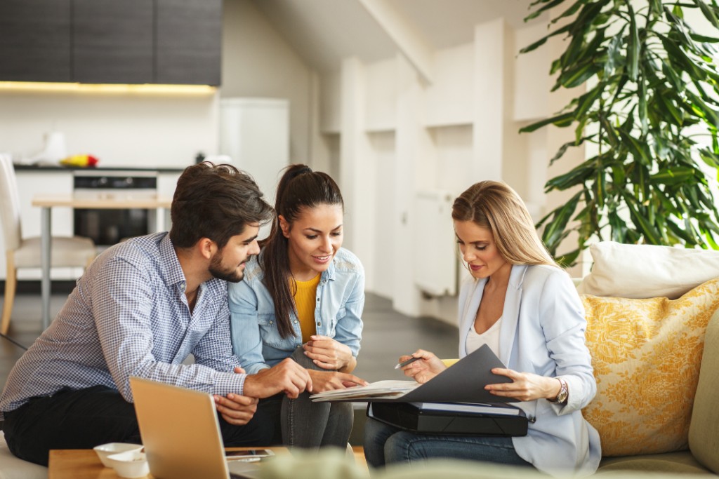 Agent presenting a real estate offer to a couple