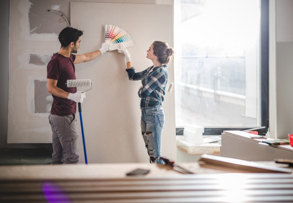 Couple deciding what to paint on the walls