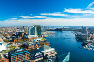 Aerial shot of Baltimore City with the Patapsco River and waterfront buildings