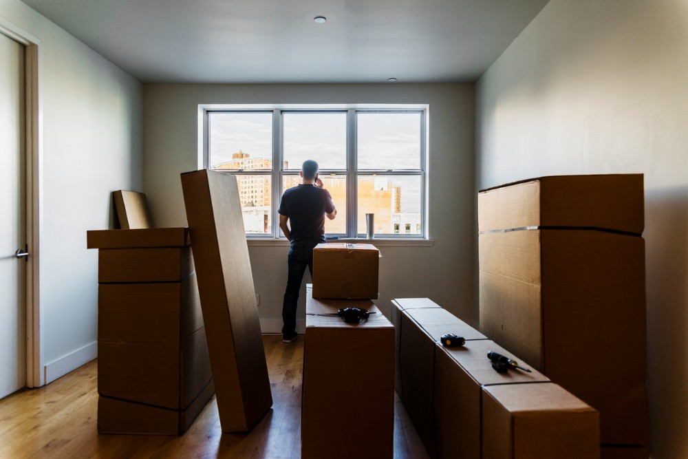 Moving In The Mature Caucasian Man Talking By Phone Nearby The Window